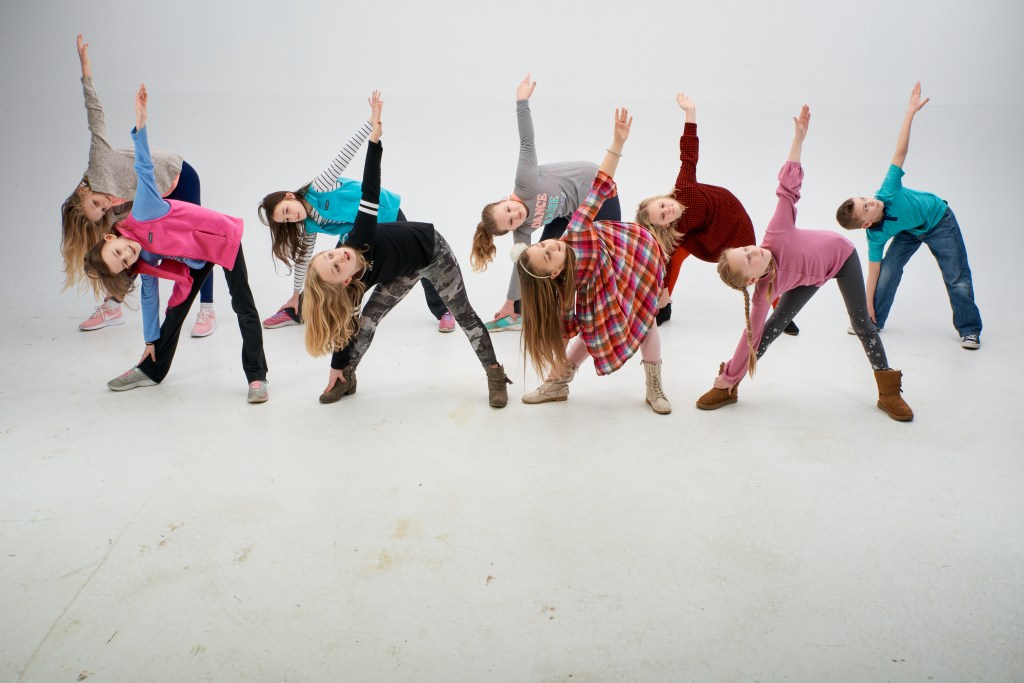 Students posing in triangle poses.