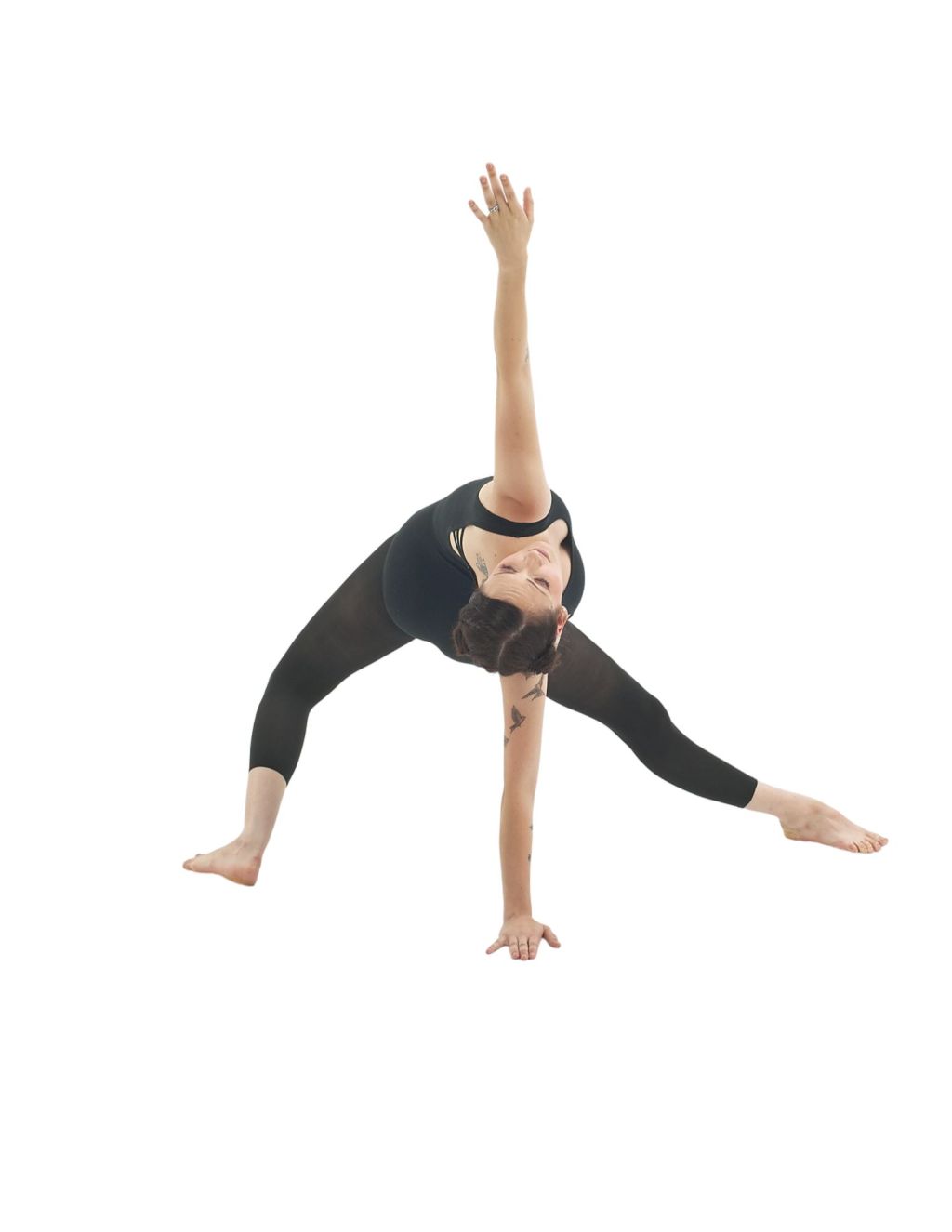 A dancer leaning back in a triangle pose.